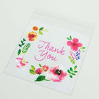 100 - Pack PVC Cookie Candy Bags White/Clear - Decorative Self Adhesive Goodie Bags With "Thank You" Print & Floral Accents for Stylish Wedding Birthday Party Favors 6"x7" - Bell Racket Store