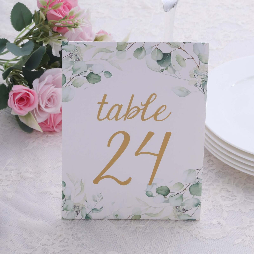 25 - Pack Paper Wedding Table Numbers 1 - 25 White/Green Eucalyptus Leaves Design - Free Standing Double Sided Table Signs with Glam Gold Foil Numbers 7" - Bell Racket Store