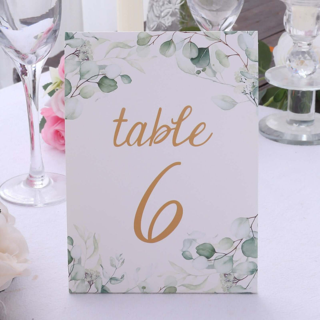 25 - Pack Paper Wedding Table Numbers 1 - 25 White/Green Eucalyptus Leaves Design - Free Standing Double Sided Table Signs with Glam Gold Foil Numbers 7" - Bell Racket Store
