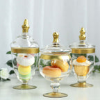 Set of 3 Glass Jars Apothecary Design Clear with Gold Trim and Snap-On Lids - Stylish Decorative Candy Buffet Storage 8.5", 9", 10"