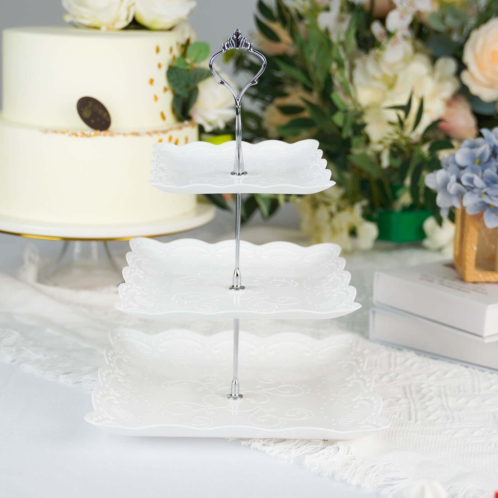 3-Tier Plastic Square Cupcake Stand Tower White - Charming Easy to Assemble Dessert Display Serving Tray Platter with Floral Embossed Scalloped Rim & Silver Handle for Tea Parties Weddings & Special Occasions 13"